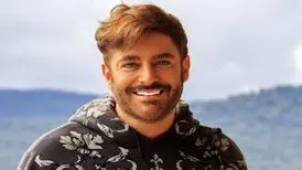 ببینید | لبخندهای بامزه رضا گلزار به همسرش در هنگام خرید کت و شلوار در دبی
